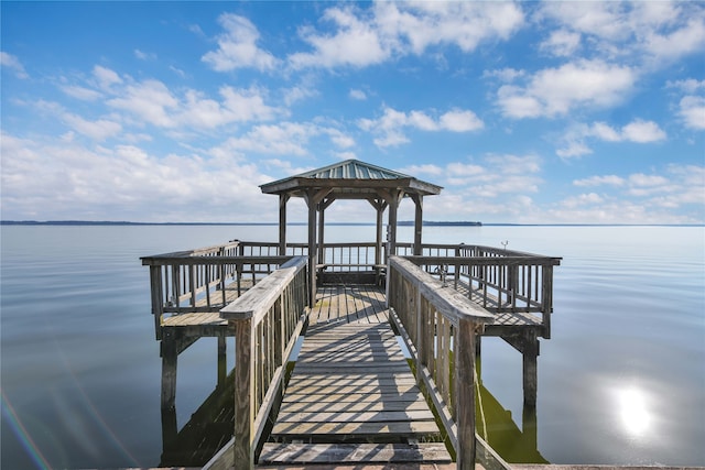 dock area with a gazebo and a water view