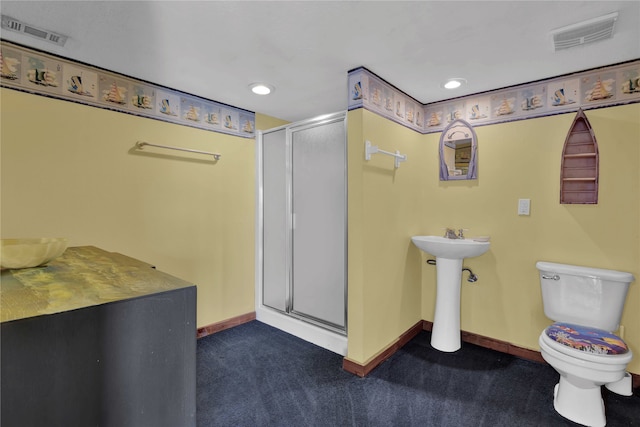 bathroom with toilet and walk in shower