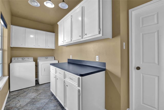 washroom with cabinets, independent washer and dryer, and light tile patterned floors