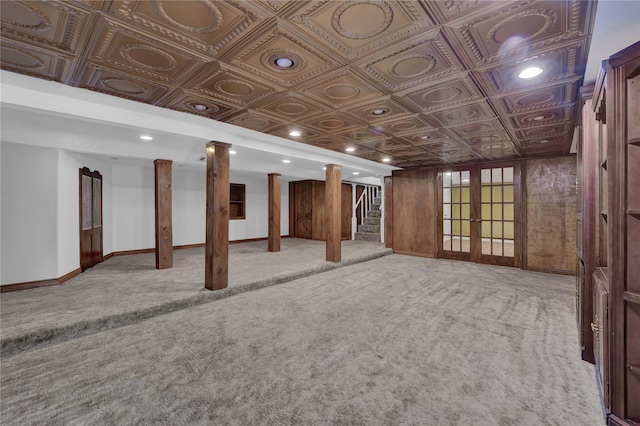 basement with light colored carpet and french doors