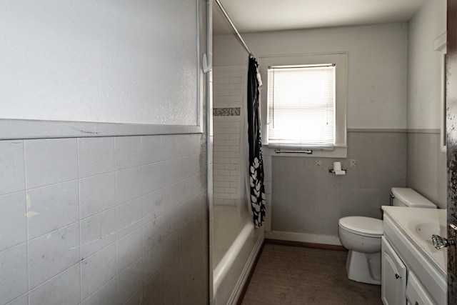 full bathroom featuring vanity, shower / tub combo, and toilet