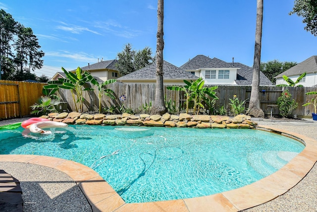 view of pool with a fenced backyard and a fenced in pool