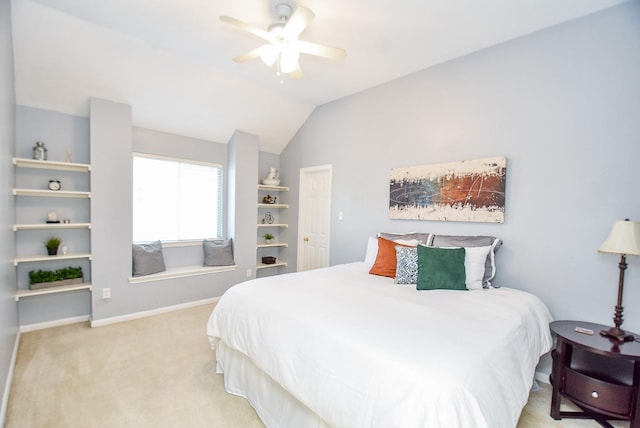 bedroom featuring lofted ceiling, a ceiling fan, baseboards, and carpet flooring