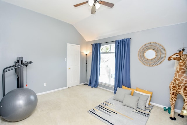 workout area with vaulted ceiling, baseboards, a ceiling fan, and light colored carpet