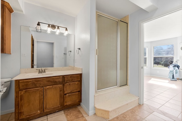 bathroom featuring a stall shower, tile patterned flooring, and vanity