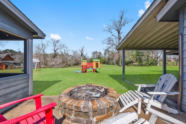 view of yard with an outdoor fire pit