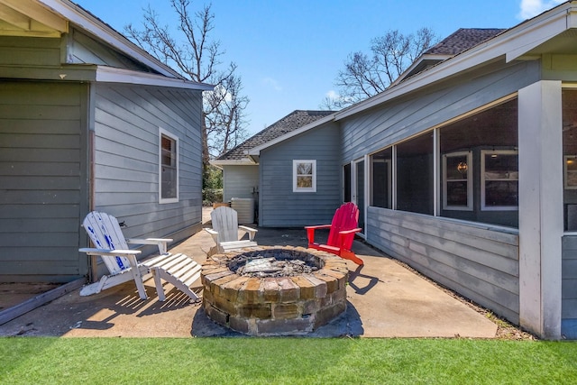 view of patio with a fire pit