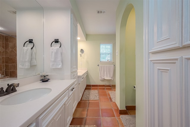 bathroom featuring tile patterned flooring and vanity