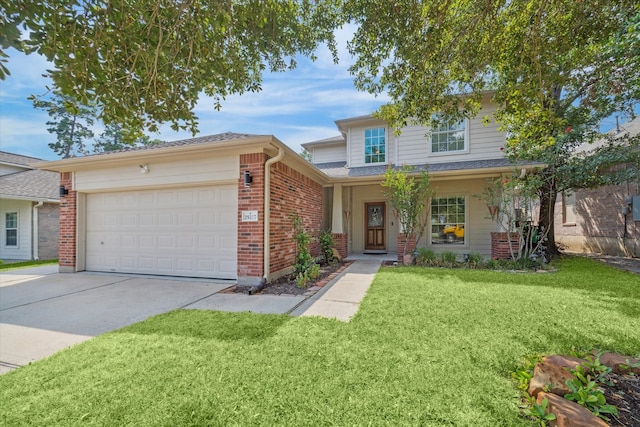 view of front of home featuring a front yard and a garage