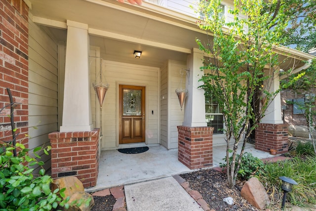 doorway to property with covered porch