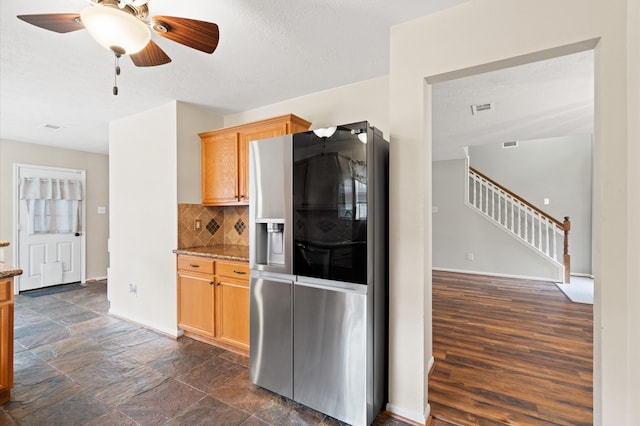 kitchen with ceiling fan, dark hardwood / wood-style floors, stainless steel refrigerator with ice dispenser, tasteful backsplash, and light brown cabinetry