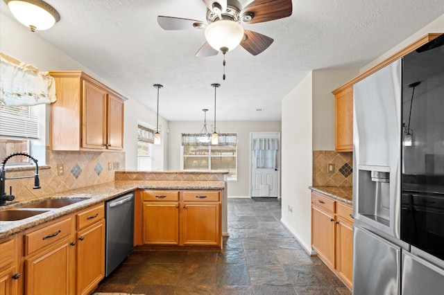 kitchen featuring kitchen peninsula, stainless steel appliances, decorative backsplash, and dark tile patterned flooring