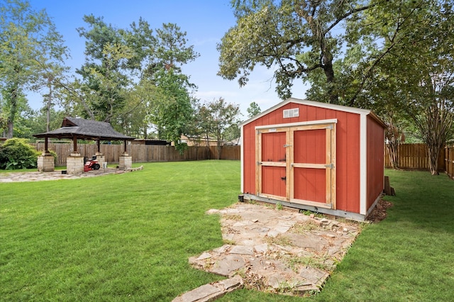 view of outdoor structure featuring a gazebo and a yard