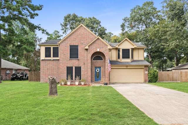 view of front of home with a front yard and a garage