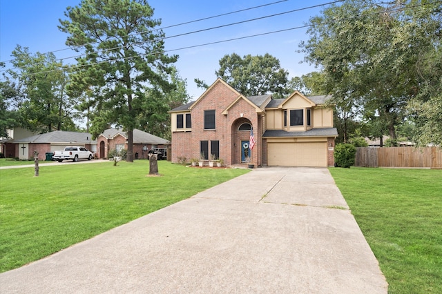 view of front of home featuring a garage and a front yard