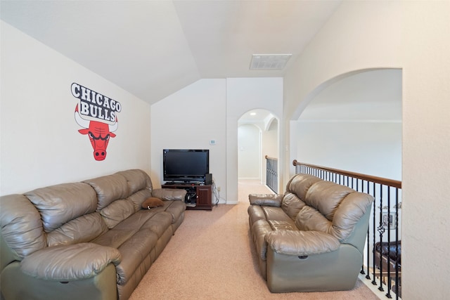 living room featuring carpet floors and lofted ceiling