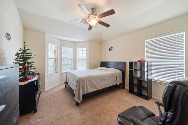 bedroom featuring ceiling fan and light carpet