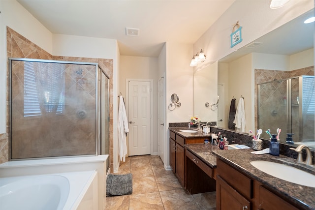 bathroom with tile patterned floors, separate shower and tub, and vanity