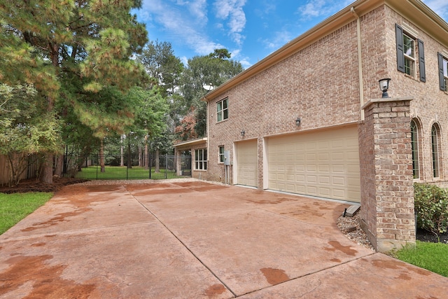 view of property exterior with a lawn and a garage