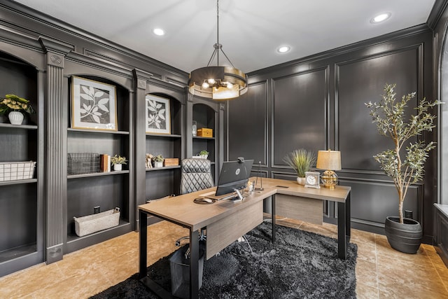 office space featuring ornamental molding, built in shelves, and an inviting chandelier