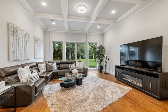 living room featuring light hardwood / wood-style floors, beamed ceiling, coffered ceiling, and crown molding