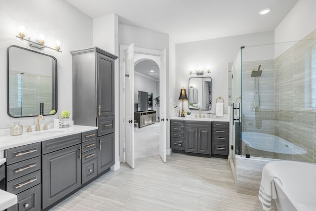 bathroom with independent shower and bath and vanity