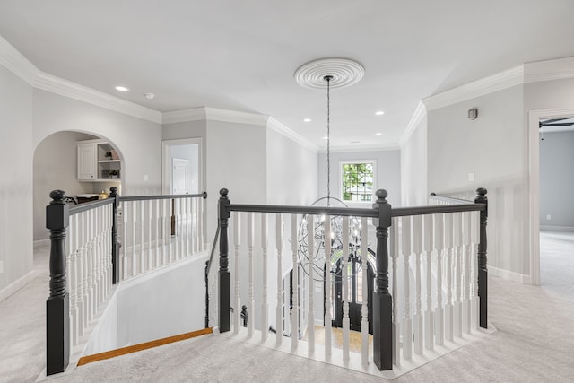 hallway with light carpet and ornamental molding