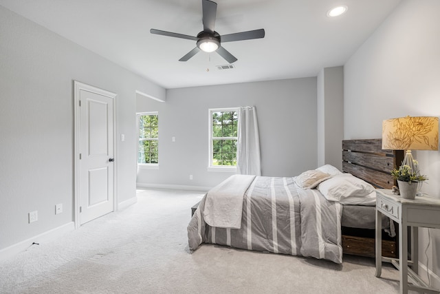 carpeted bedroom featuring ceiling fan