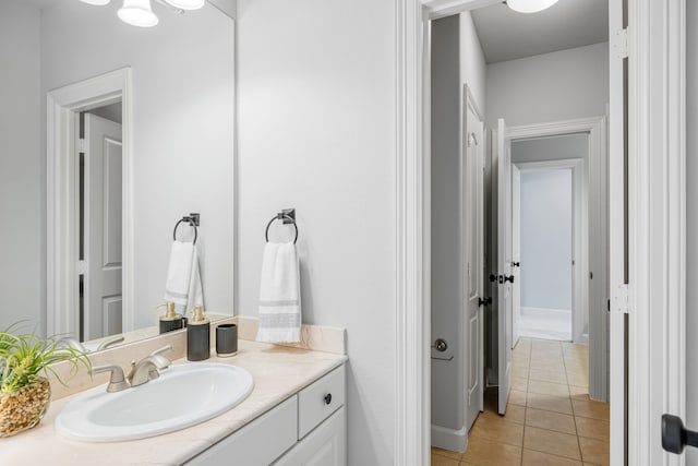 bathroom featuring tile patterned flooring and vanity