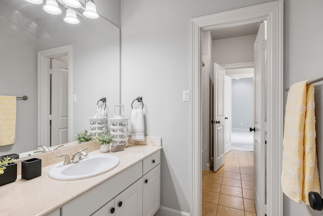 bathroom with tile patterned flooring and vanity