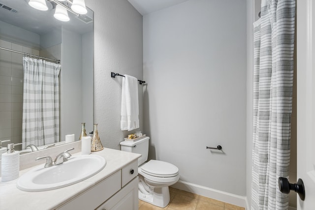 bathroom featuring tile patterned floors, walk in shower, vanity, and toilet