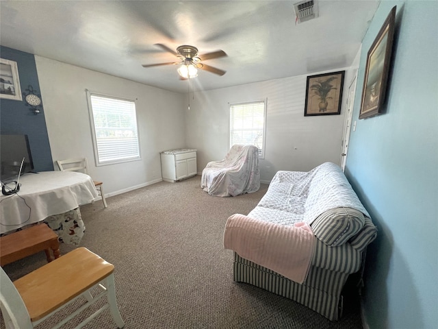 interior space with ceiling fan