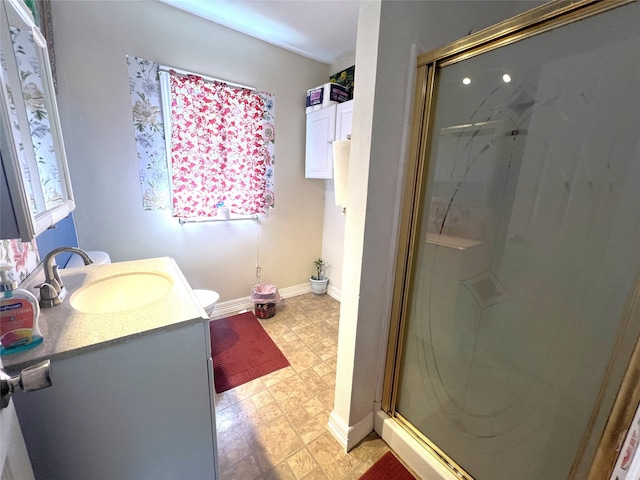 bathroom featuring tile patterned flooring, a shower with door, toilet, and vanity