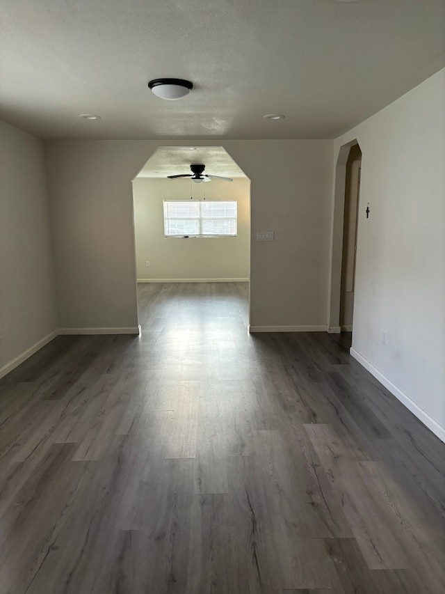 unfurnished room featuring ceiling fan and hardwood / wood-style floors