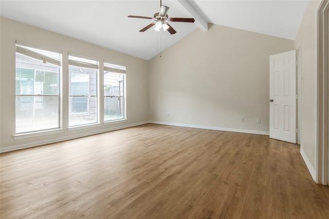 empty room with ceiling fan, light hardwood / wood-style flooring, and vaulted ceiling with beams