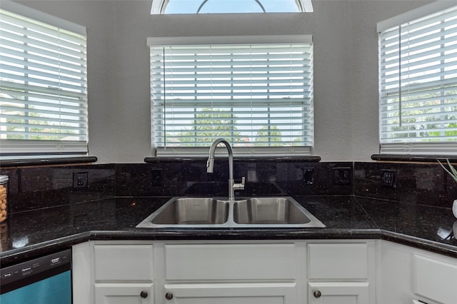 kitchen with sink, decorative backsplash, white cabinetry, and dishwasher