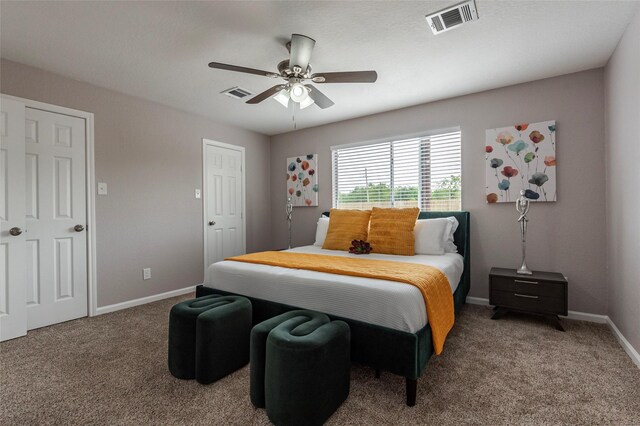 bedroom with ceiling fan and carpet flooring