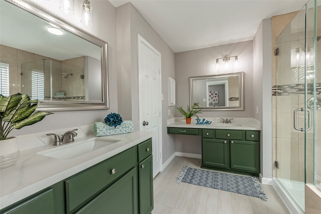 bathroom with tile patterned flooring, a shower with door, and vanity