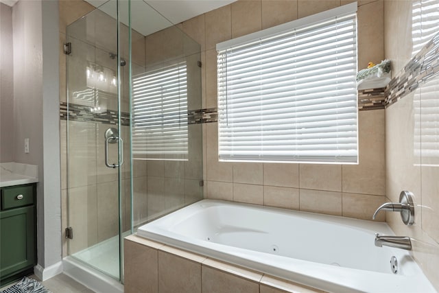 bathroom featuring separate shower and tub and vanity