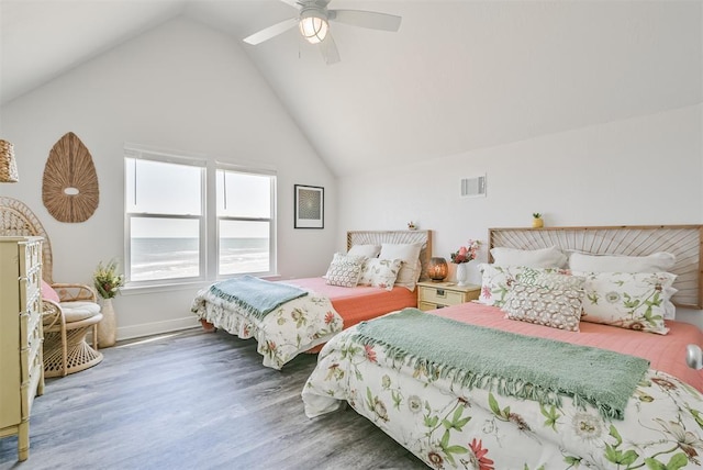 bedroom featuring dark wood-style floors, ceiling fan, visible vents, and high vaulted ceiling