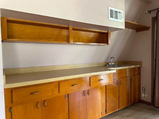 kitchen featuring sink and dark hardwood / wood-style flooring