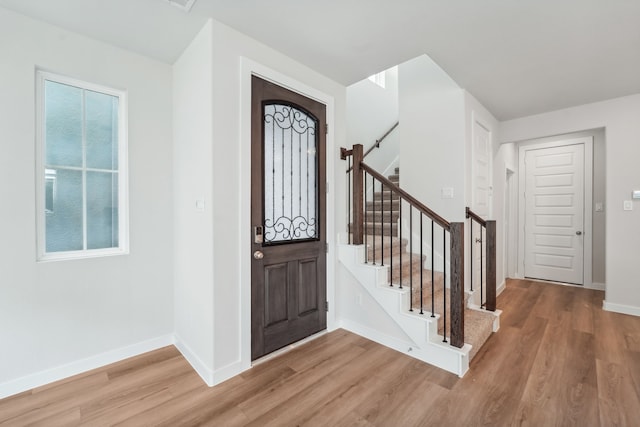 entryway with wood-type flooring