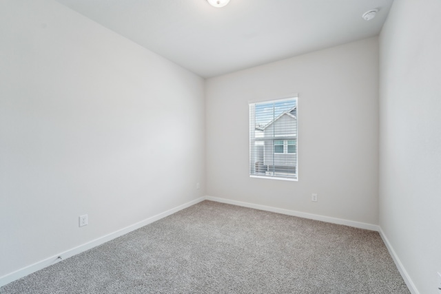 unfurnished room featuring carpet