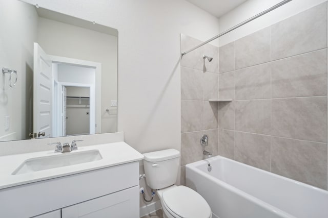 full bathroom with tiled shower / bath combo, toilet, and vanity