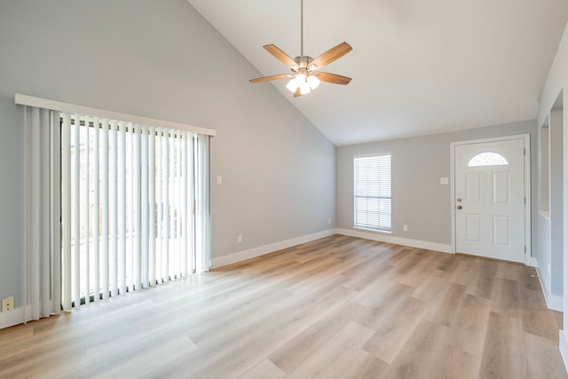 entrance foyer with high vaulted ceiling, ceiling fan, and light wood-type flooring