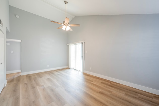 empty room with light hardwood / wood-style flooring, ceiling fan, high vaulted ceiling, and beamed ceiling