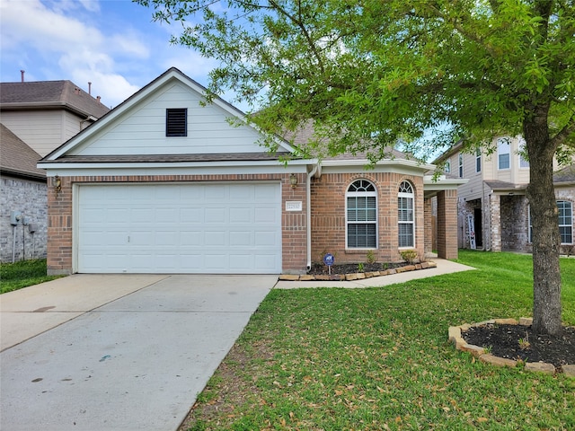 view of front facade with a front yard and a garage