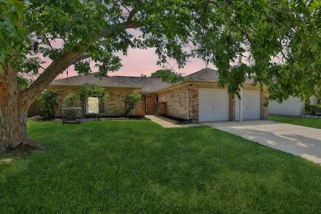 ranch-style house with a lawn and a garage