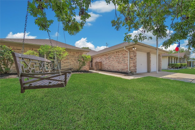 view of front of property featuring a garage and a front yard