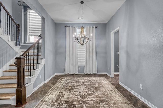 unfurnished dining area featuring a chandelier